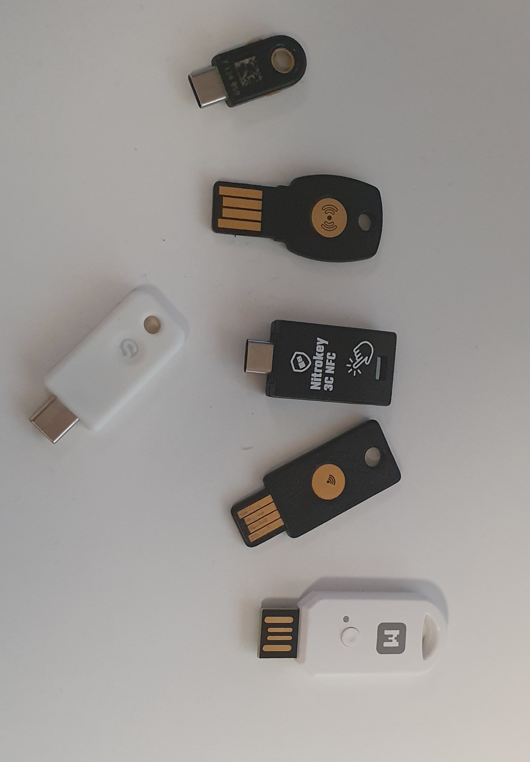 A collection of USB security tokens on a table