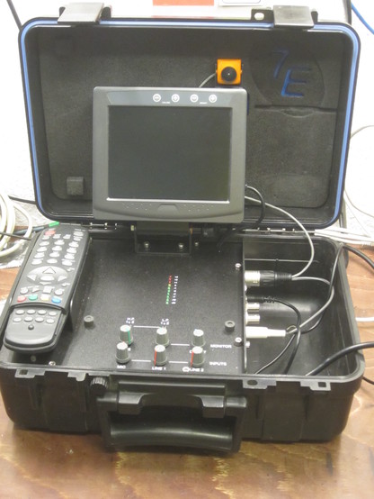 7e Communications (Motionmedia) Talking Head VideoReporter: View of the phone screen, remote control and codec unit inside ruggedized pelicase.
