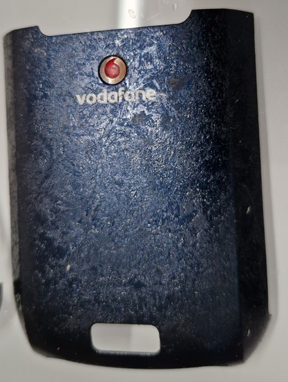 back panel of a Palm Treo whose rubber coating has estensive de-polymerisation (became goo-ey)