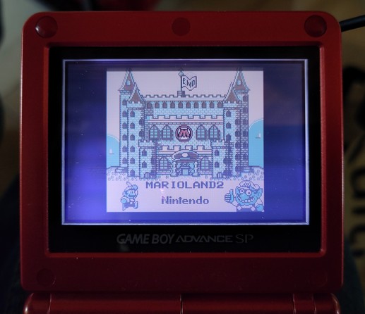 End screen of Mario Land 2, showing Mario's castle, on a Gameboy Advance SP Swissgamer Edition