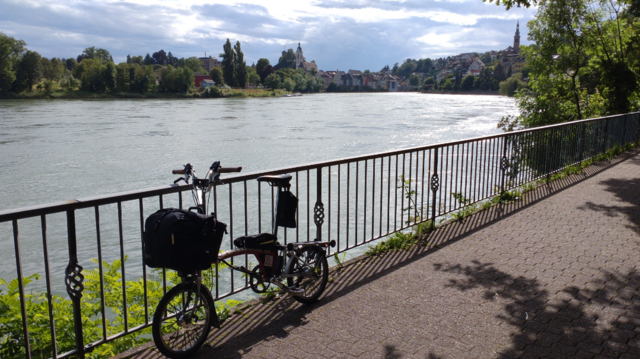 View on both Laufenburgs, the Swiss (left) and the German one (right) on both sides of the Rhine. My Brompton is leaning on a guarding fence on a stilted way above the riverside.