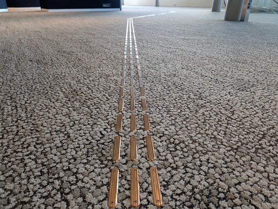 Guiding lines on carpet 