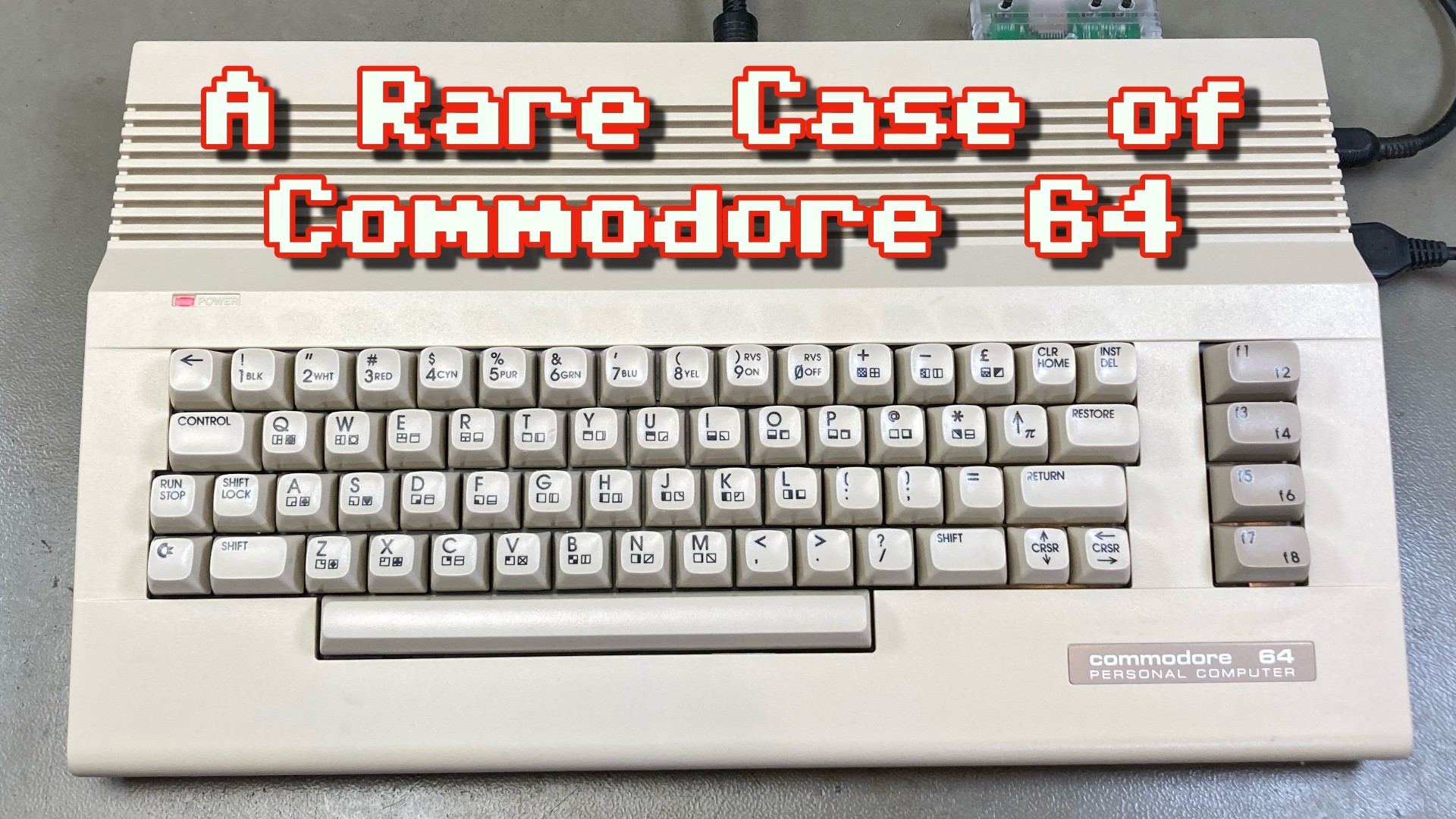 Thumbnail for my video, showing a Commodore 64C on my workbench. The overlayed text reads: "A Rare Case of Commodore 64".