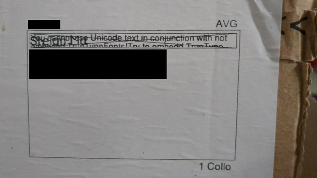 address sticker on a package, with some details blacked out. the name is partly "visible" but a warning is superposed  with a box that says "You cannot use unicode text in conjunction with not standard TrueType fonts! Try to embedd TrueType" the rest is missing due to clipping.