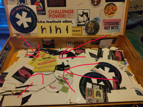 Sticketbox in der cbase mit unter anderem die Nevermind the Fediverse Aufkleber