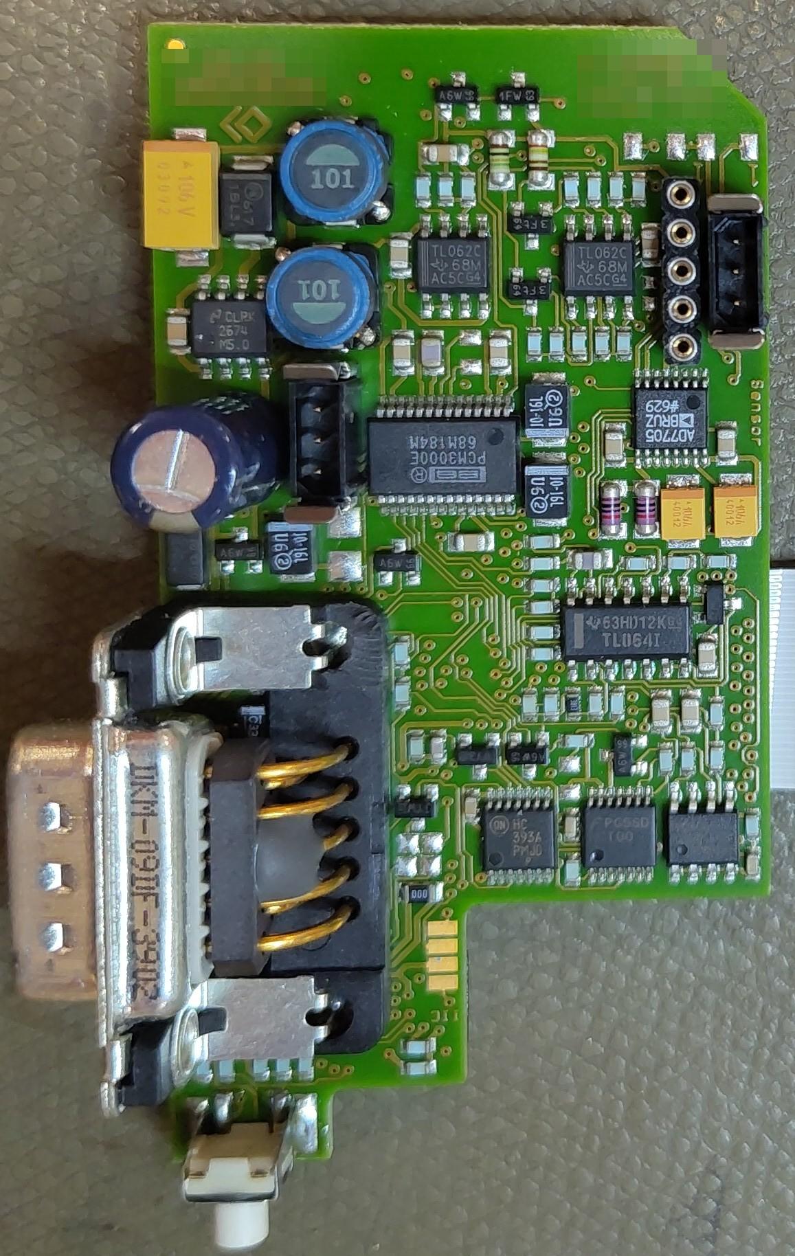 A green circuit board with a DE-9 connector.
It has lots of other components